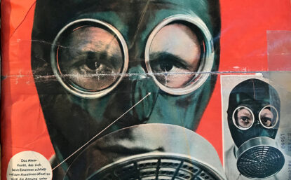 杂志封面显示一个人穿透镜防毒面具,脸部特征可见下方